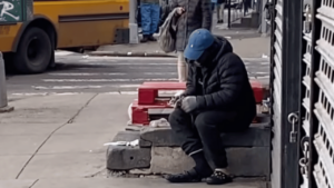 Shocking video shows a New York City man eating dead rats on the street, onlookers gasping in fear (video)